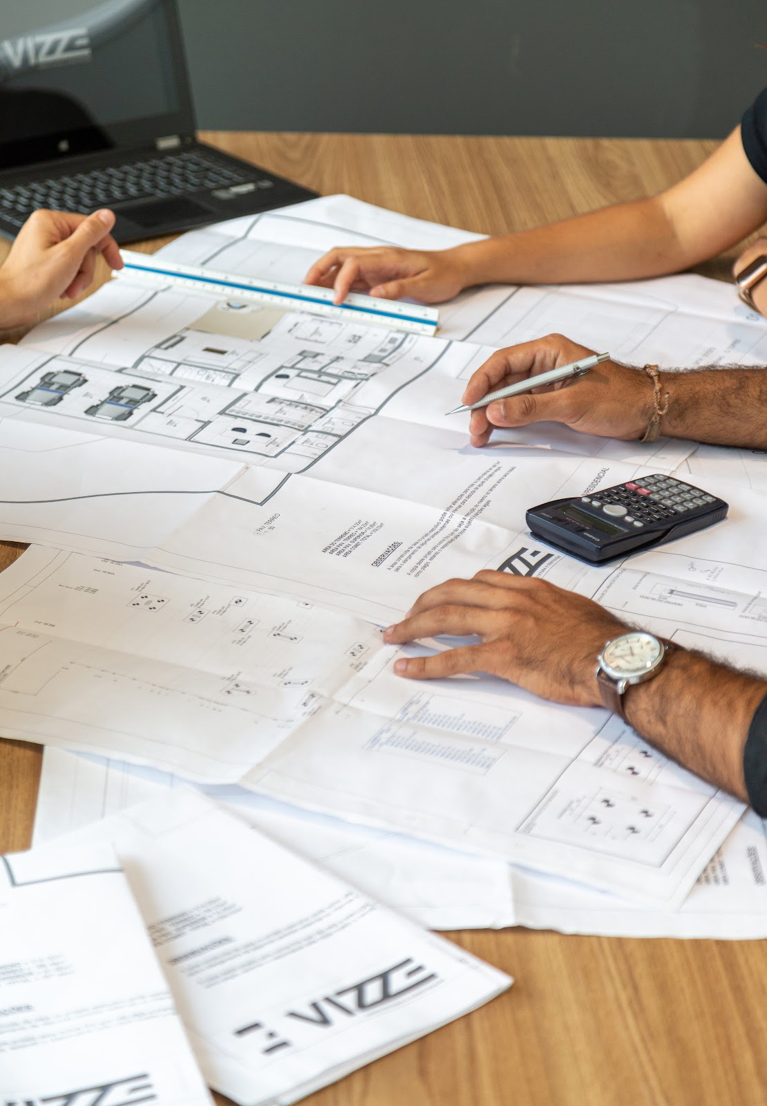 Project team reviewing building plans